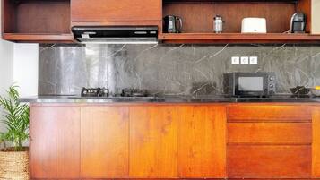 Fridge, microwave, stovetop, coffee/tea maker