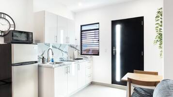 Fridge, microwave, stovetop, coffee/tea maker