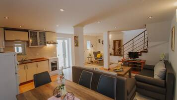 Villa (Three Bedroom Villa with Pool) | Living room | 32-inch flat-screen TV with cable channels