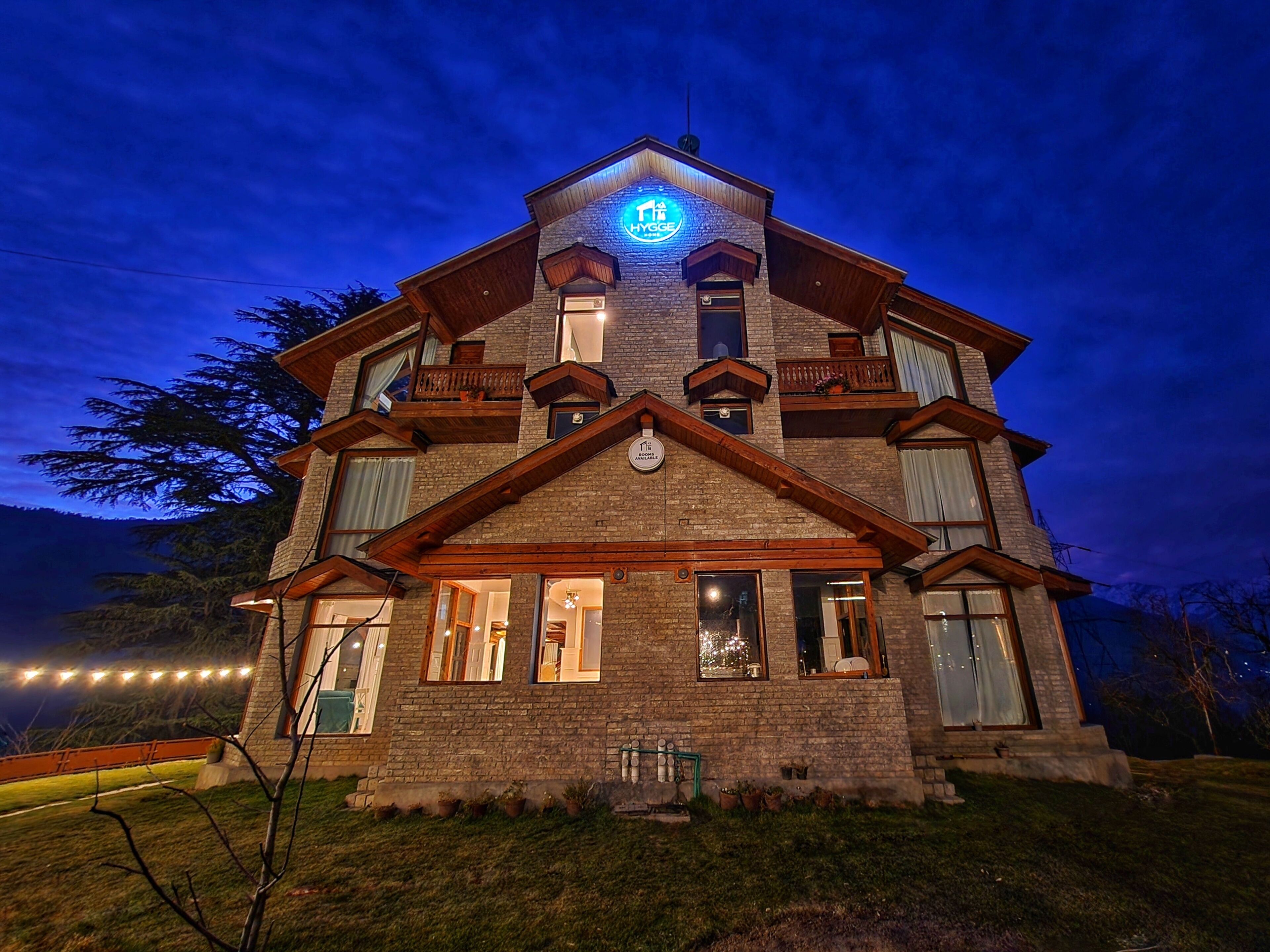 A two-story building with a prominent sign at the top.