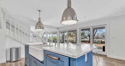 Waterfront Retreat with Private Dock and Fire Pit, Sleeps 8, Outdoor Dining, Spa-Style Primary, Chef’s Kitchen w/ Dual Dishwashers, Gas Fireplace, River Views, Bright Open Layout, Central A/C, Perfect Coastal Escape for Families, 24 Hr Hospitality