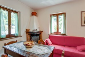 Comfort House, 3 Bedrooms | Living room | Fireplace - Holiday Home in Assisi With Pool (Assisi)