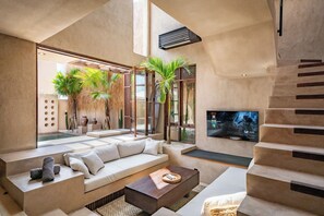 Junior Villa, Pool View | Living area | 55-inch Smart TV with digital channels, Netflix, streaming services - Villa Mapu at Bocoa Villas (Canggu)