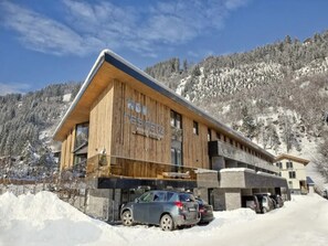 A wooden building with a sign reading 'Residenz' in a snowy mountainous area. - Top-Floor Mountain Penthouse for 8 (Neukirchen am Großvenediger)