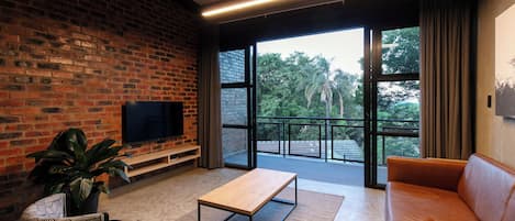 Apartment, 1 Bedroom | Living area | 32-inch flat-screen TV with satellite channels