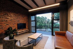 Apartment, 1 Bedroom | Living area | 32-inch flat-screen TV with satellite channels