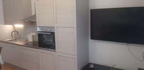 Deluxe Apartment, 2 Bedrooms | Private kitchen | Fridge, microwave, oven, dishwasher