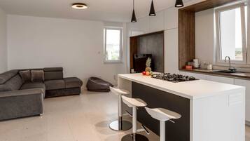 Apartment (Three Bedroom Apartment with Sea View) | Living room | 32-inch flat-screen TV with cable channels, stereo