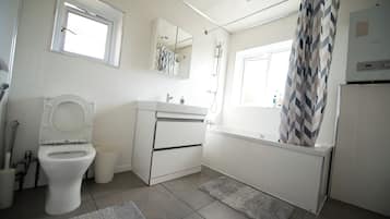 Bidet, towels, soap, toilet paper