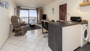 A modern apartment with a living area, dining space, and kitchen. - Apartment in Blankenberge Near Marina (Blankenberge)