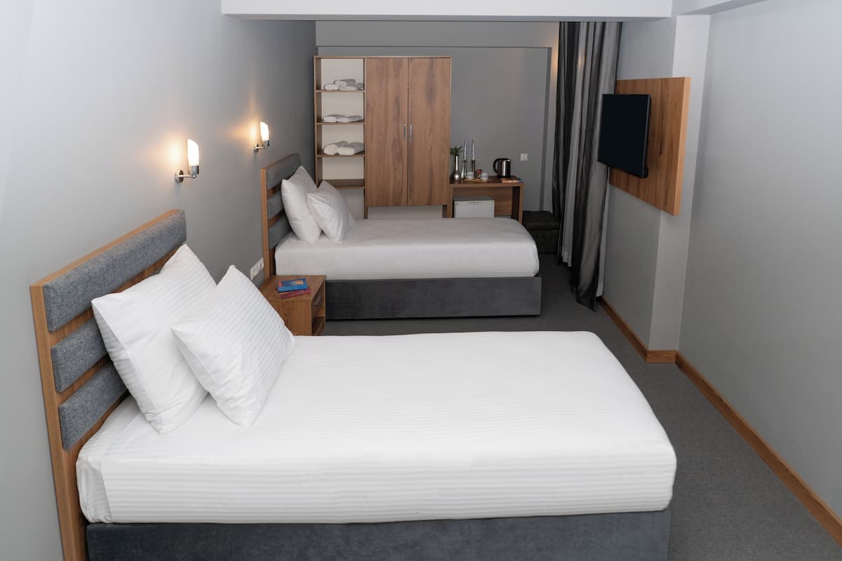 Habitación superior, 2 camas individuales | Ropa de cama de alta calidad y minibar
