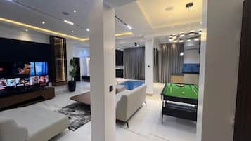 Economy Apartment, Balcony, City View | Living area | Flat-screen TV