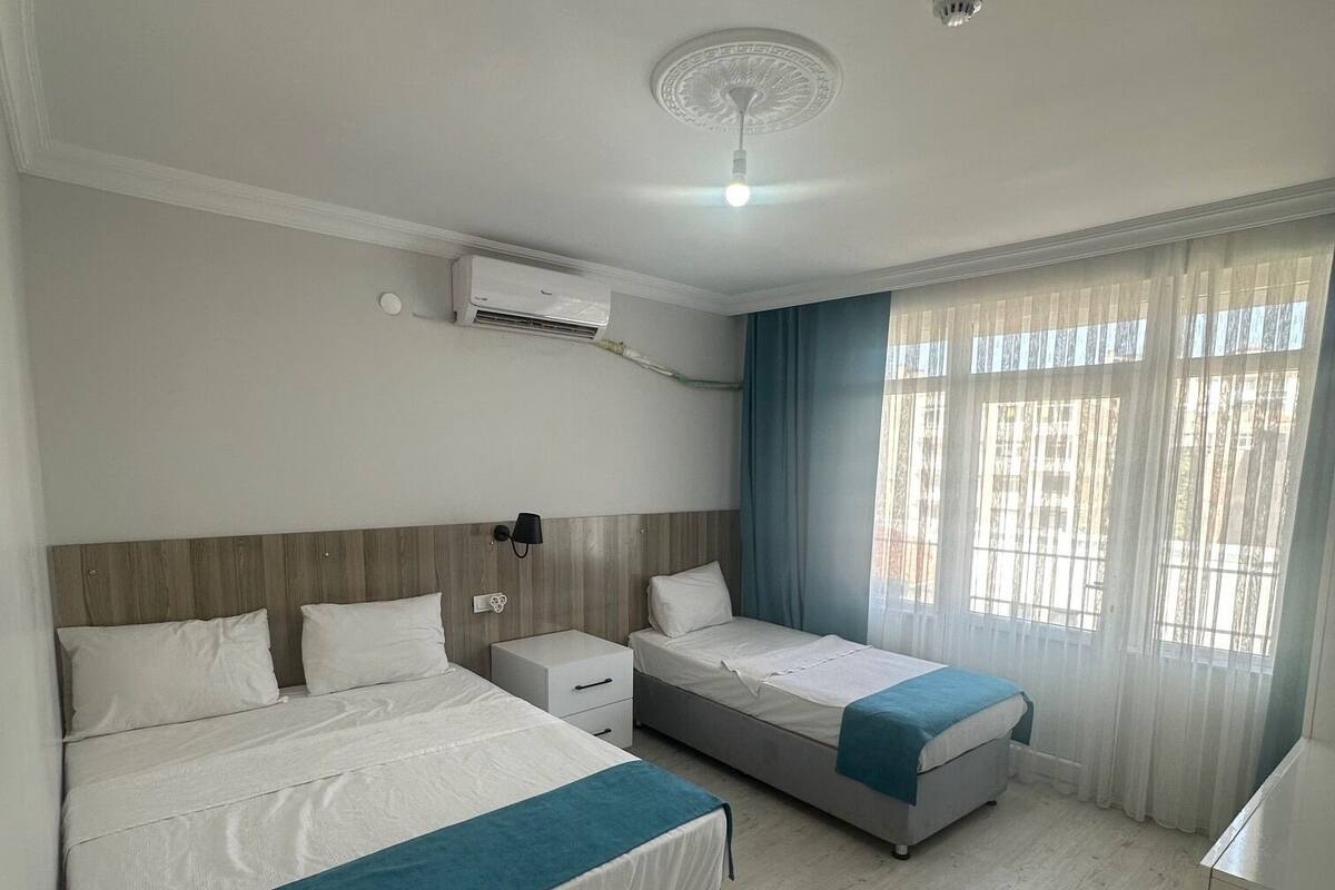 Family Room, Multiple Bedrooms, Balcony, City View | Laptop workspace, WiFi (free), bed sheets