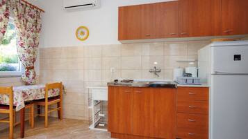 Apartment (One Bedroom Apartment with Balcony) | Private kitchen | Fridge