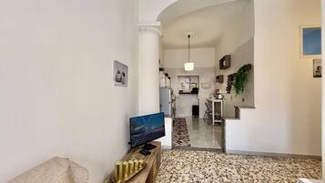 Deluxe Apartment, City View | Living area | Flat-screen TV