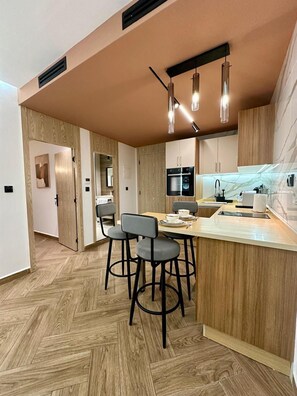 Deluxe Apartment, 2 Bedrooms | Living area | 50-inch Smart TV with satellite channels, fireplace, Netflix