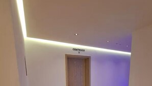 A hallway with a wooden door labeled "CENTRICO 7". - CENTRICO (Tangier)