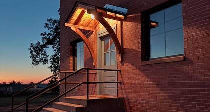 Experience a cozy, curated stay in our beautifully restored 5BR Schoolhouse and a hydrotherapy massaging hot tub.