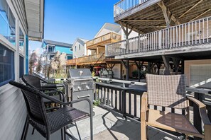 Enjoy dining or socializing on the patio with comfortable wicker chairs and a table.