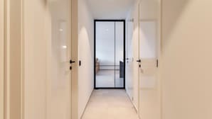 A modern hallway with a sliding glass door leading to a balcony. - Apartment in Blankenberge Near the Beach (Blankenberge)
