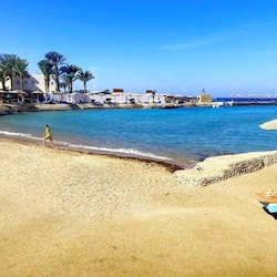 Private beach, beach umbrellas, beach towels, beach massages