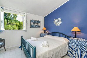 Family Villa, 4 Bedrooms (Una Finesta Sul Mare Capocaccia) | 4 bedrooms, laptop workspace, iron/ironing board, free WiFi