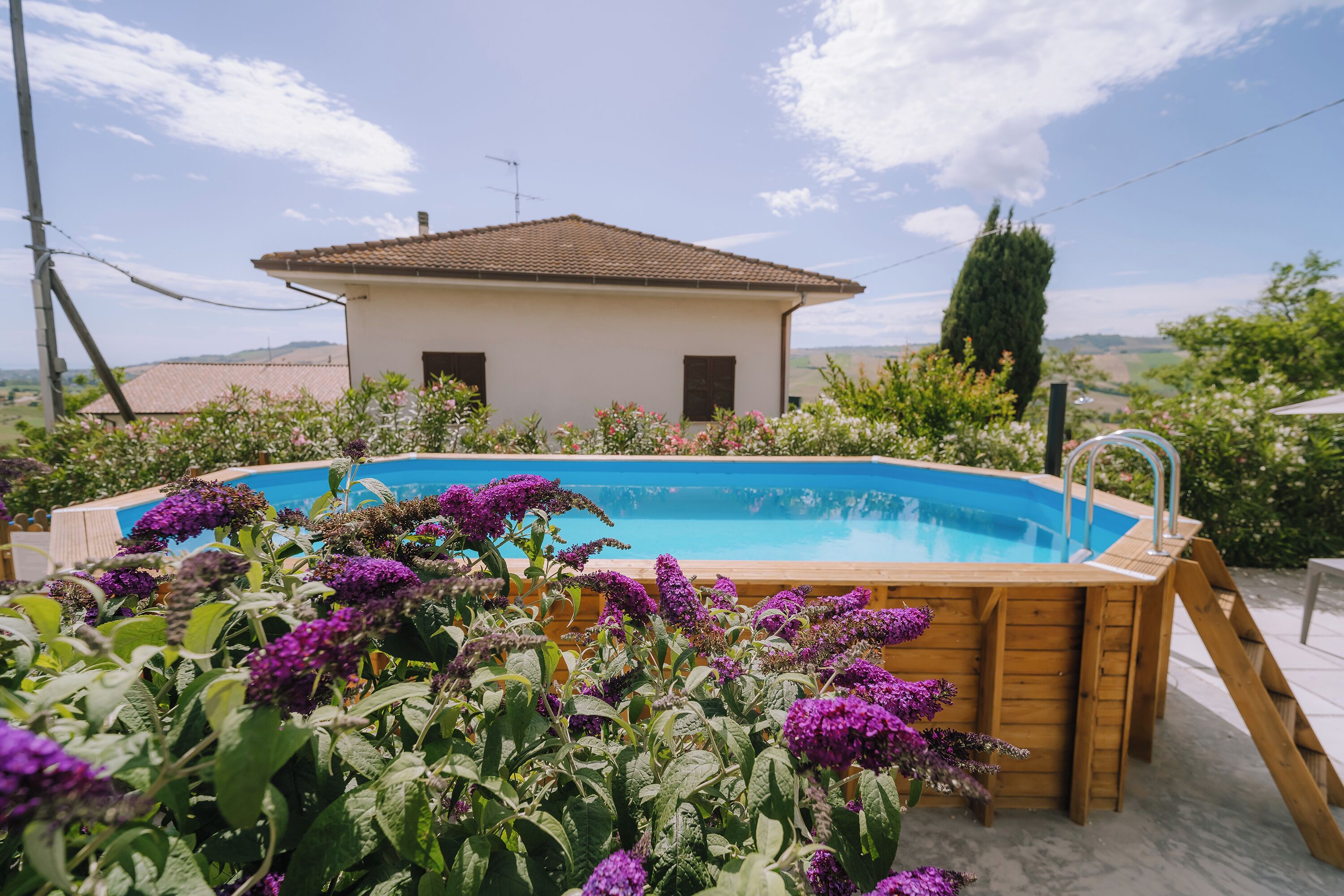 Seasonal outdoor pool, open 9:00 AM to 8:00 PM, pool umbrellas
