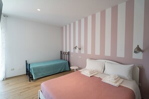 Quadruple Room | 1 bedroom, desk, laptop workspace, blackout drapes
