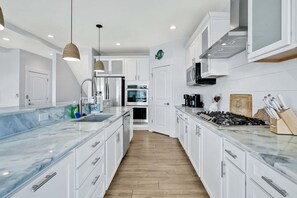 Fridge, microwave, oven, stovetop - Experience luxury at Salt and Light in Ocean Isle Beach, perfect for 24 guests! (Ocean Isle)