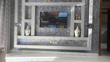 Relax in style with a flat-screen TV and comfortable seating area.