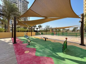 Children's area - Urban Sanctuary Studio w/ Pool, Gym and Playground (Dubai)