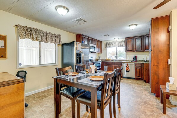 Enjoy meals in this well-equipped kitchen with a dining table for four.