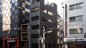 A hotel with a modern facade, multiple floors, and a visible entrance. - Real Life Iidabashi 1-bedroom Cozy 3pax Hi-end (Tokyo)