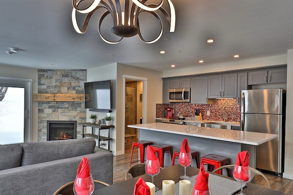 Renovated 2-room, 2-bath condo with a fully equipped kitchen, private patio with an electric grill, and access to a heated outdoor pool.