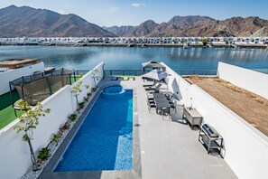 Pool - Coastal Bliss 4BR + Maid's w/ Heated Pool & Jacuzzi in Al Dana Island, Fujairah (Fujairah)