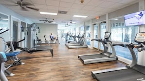 A gym with treadmills, stationary bikes, and weight machines. - 4-bedroom house on Longboat Key with private beach access only 150 yards away. (Longboat Key)
