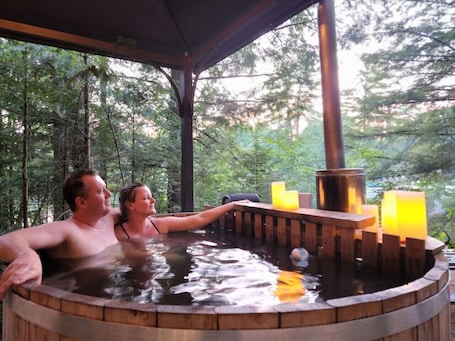 Spa. `Oda` Log Cabin with Cedar Hot Tub & Sauna on wood