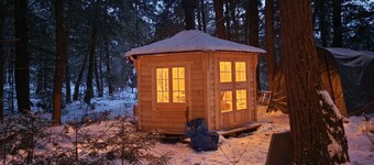 "Oda" Log Cabin with Cedar Hot Tub & Sauna on wood