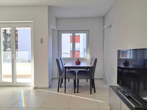 Classic Apartment | Living area | 32-inch flat-screen TV with satellite channels