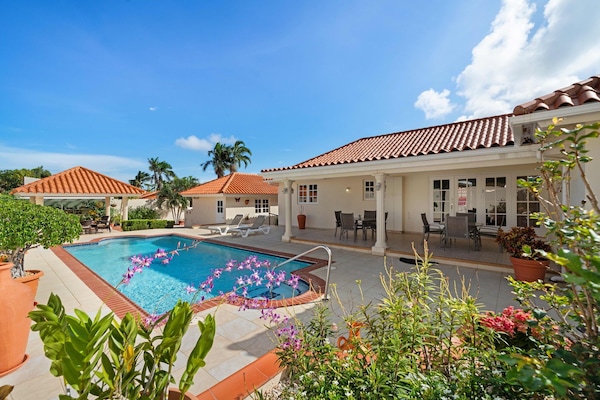 - Dive into paradise with this stunning private pool, surrounded by serene greenery and vibrant flowers - The perfect escape for sunny days and starry nights under the tropical sky - Relax, unwind, and let the beauty of the outdoors recharge you