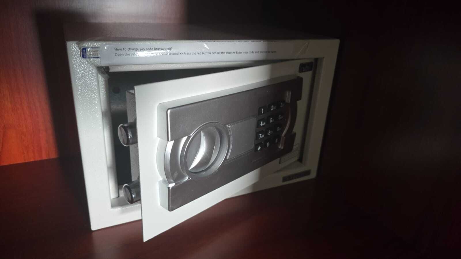 A safe with a keypad and a lock.