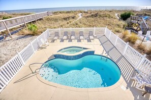 A pool area with a hot tub, lounge chairs, and a view of the beach. - 6 BR OceanFront w/ Heated Pool/Hottub Cherry Grove (North Myrtle Beach)
