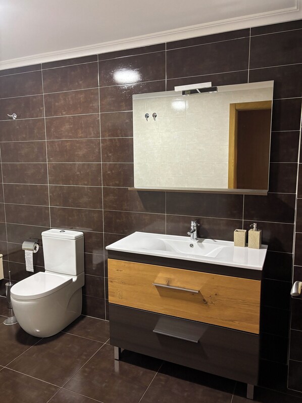 Hair dryer, bidet, towels, soap