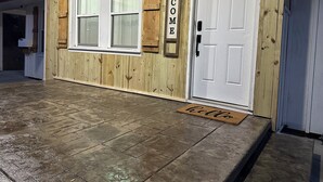 A wooden exterior with a white door, a welcome sign, and a doormat. - Winston Salem 3Bd 2Ba GAME ROOM mins to Downtown (Winston-Salem)