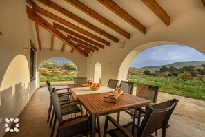 Enjoy meals with family and friends in this spacious dining area with a wooden table and six chairs.