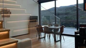 Family Apartment, Balcony, Mountain View | Living area | Flat-screen TV