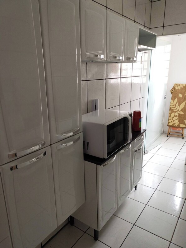 Private kitchen - Cozy Simple Apartment with air conditioning (Morada dos Nobres Araçatuba)