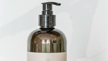 A bottle of dish soap with a pump dispenser.