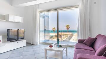 Deluxe Apartment, 2 Bedrooms, Terrace, Sea View | Living room | TV