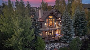 A multi-story house with a balcony, surrounded by trees. - Hot Tub + Close to Skiing – Lariat Ridge Lodge (Steamboat Springs)